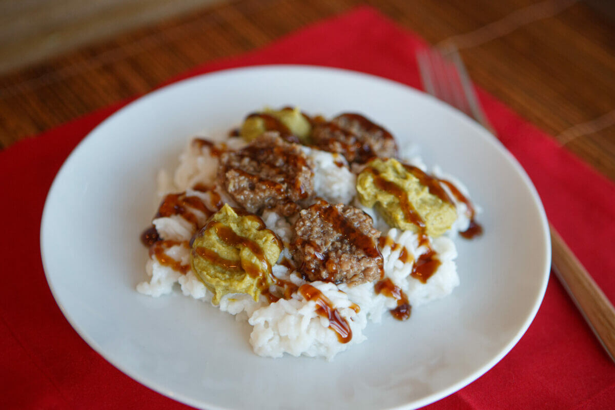 Beef and broccoli stir fry dish on a white plate