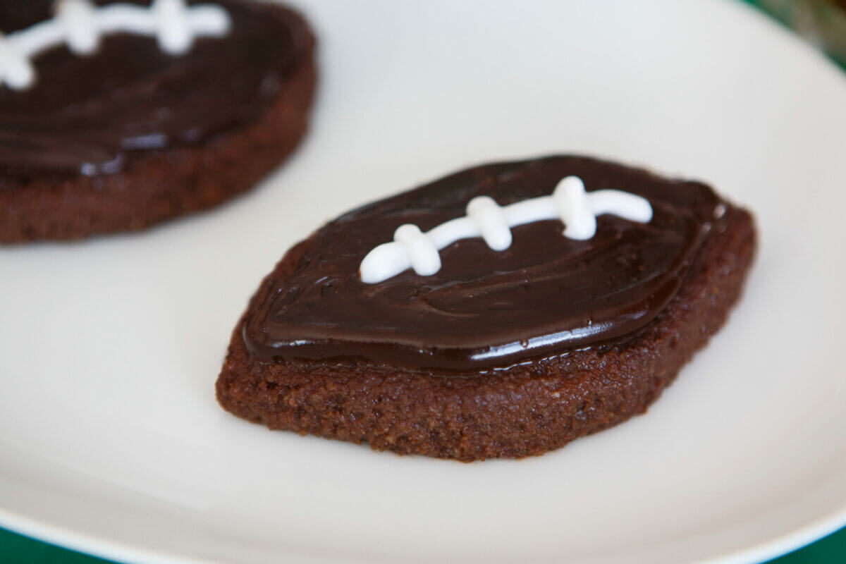Dysphagia-friendly football brownies on white plate