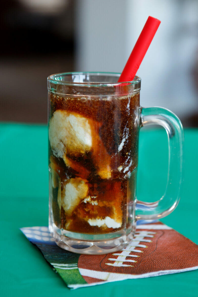Dysphagia-friendly root beer float in a glass with a red straw