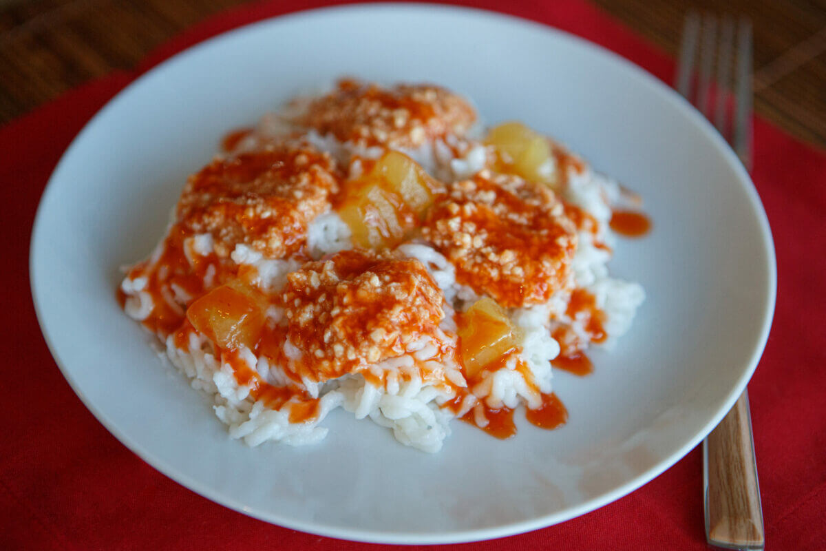 Dysphagia-friendly sweet and sour chicken in a white bowl