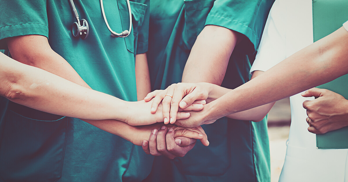 Nurses holding hands