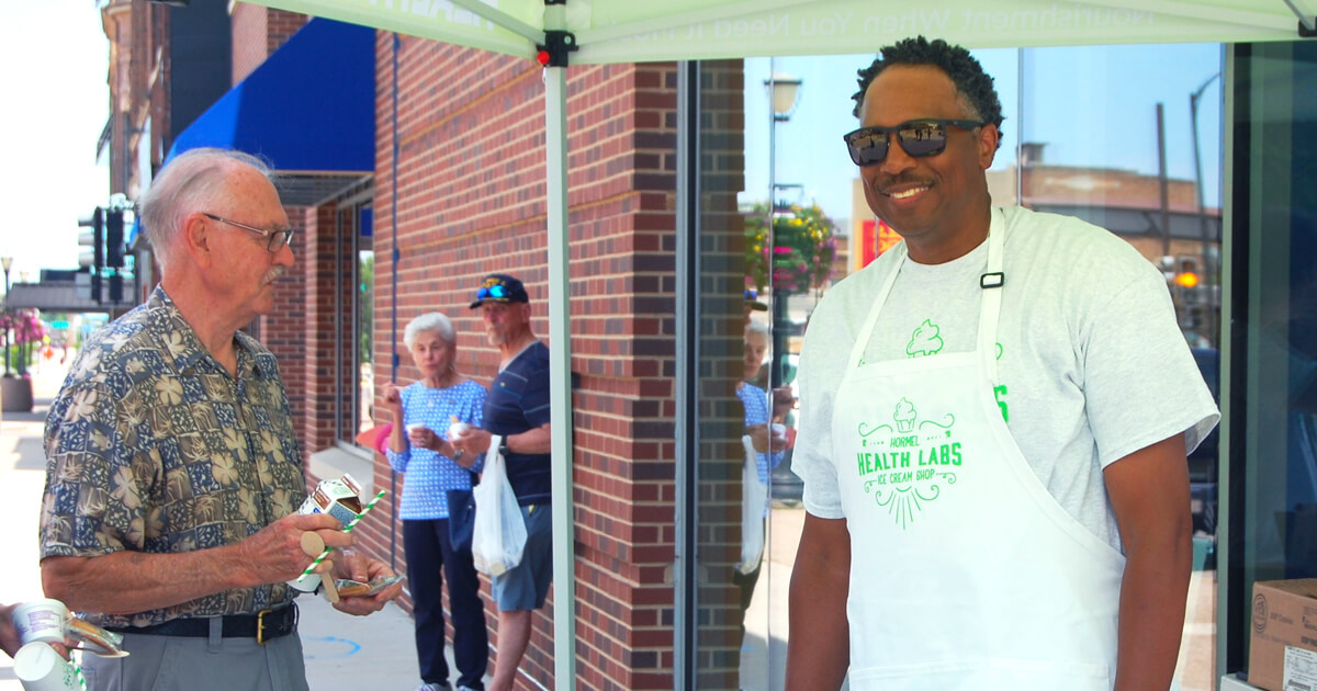 Members of the Austin community visiting the Hormel Health Labs Ice cream tent outside the SPAM Museum