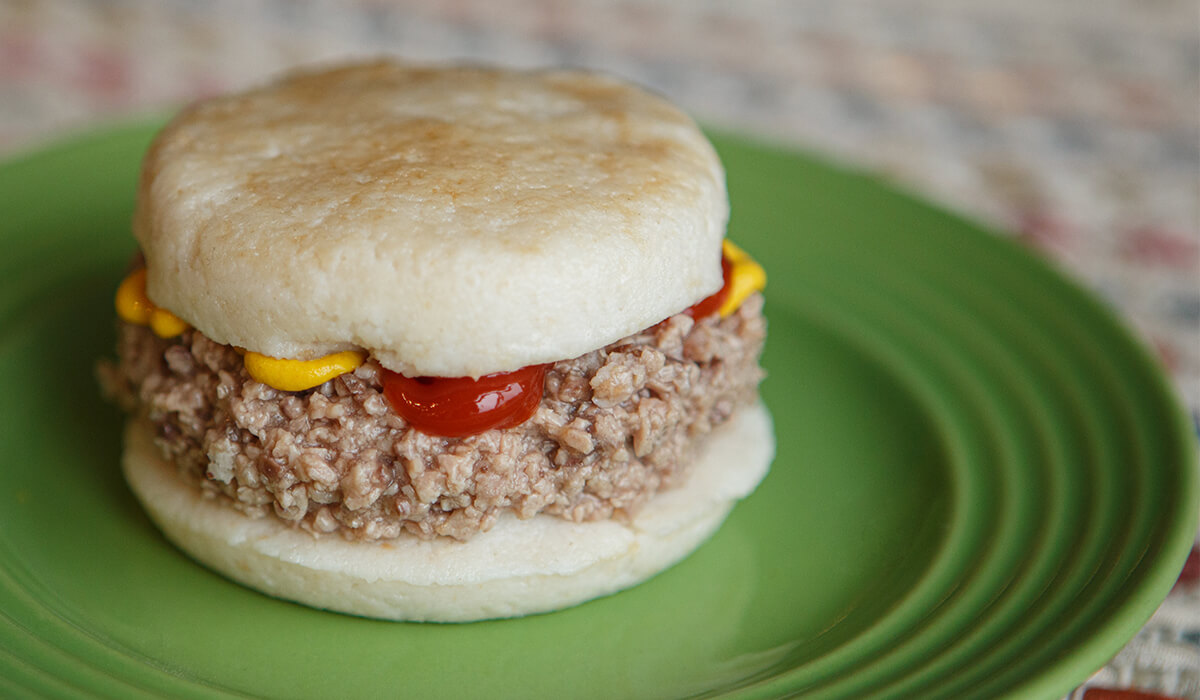 An easy to swallow Thick and Easy® burger on an easy to swallow bun