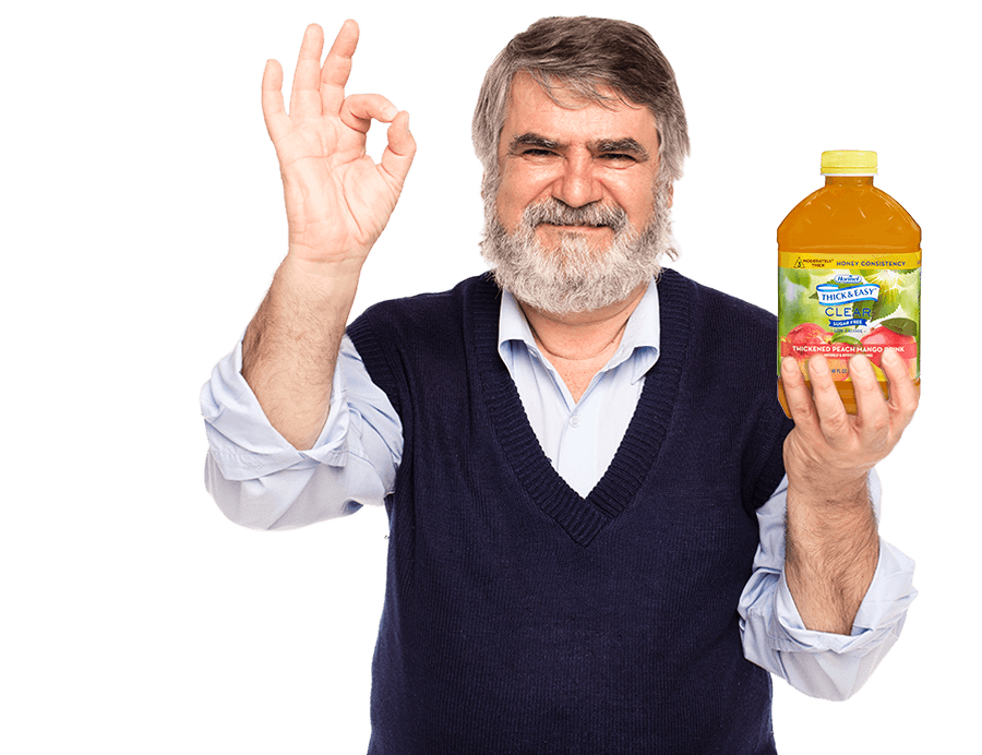 Older Man holding a bottle of Thick and Easy Clear