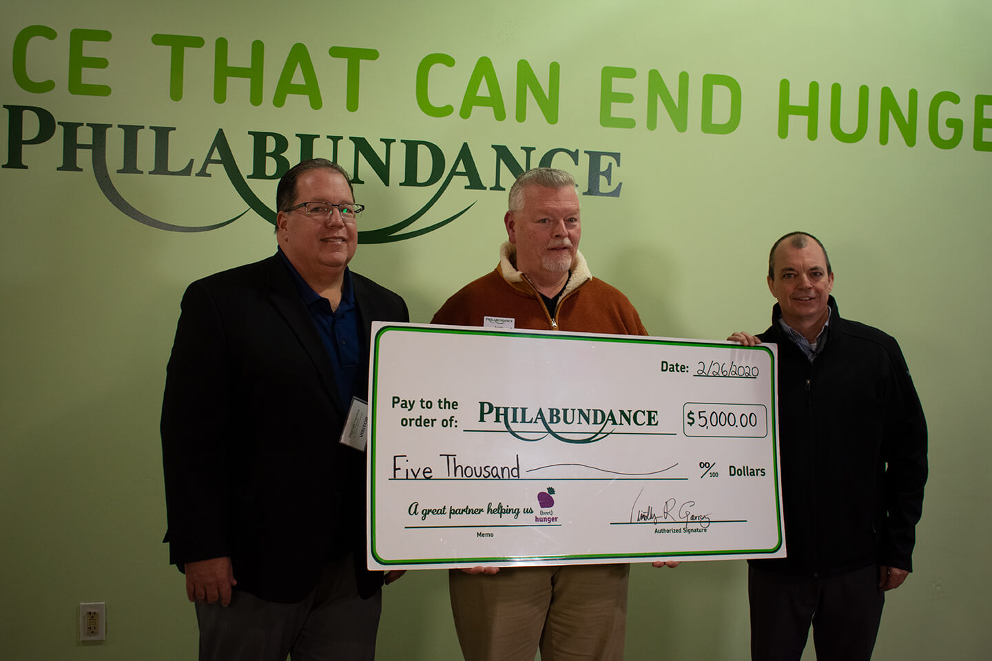 Hormel Health Labs donating check to Philabundance