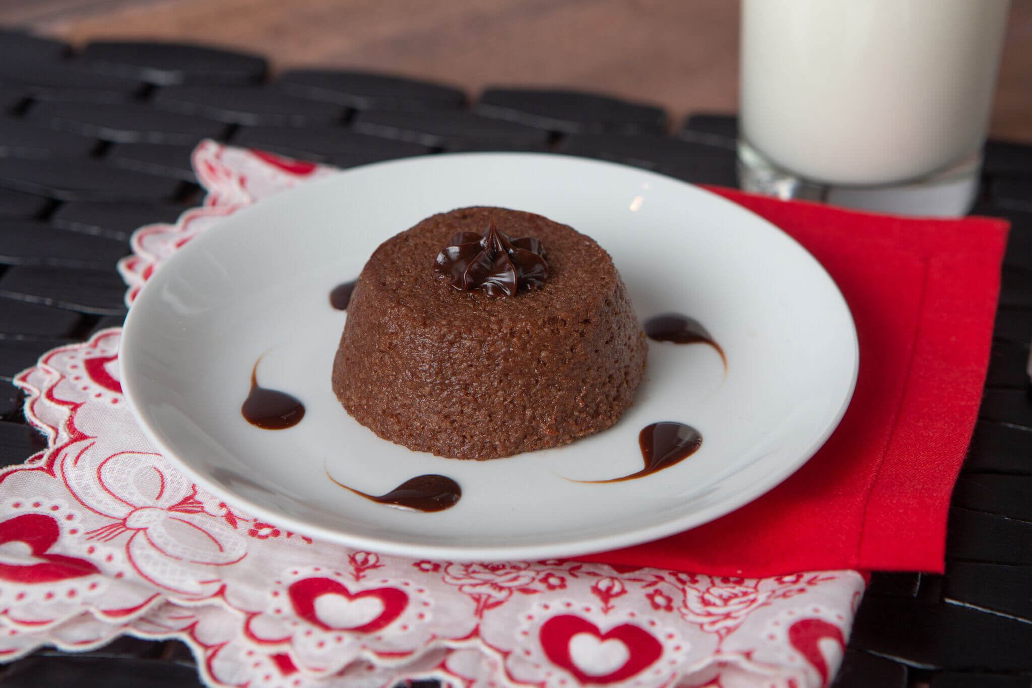 A pureed chocolate lava cake on a plate